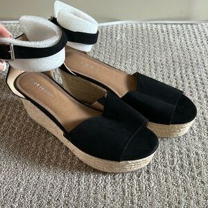Women’s black and beige wedges